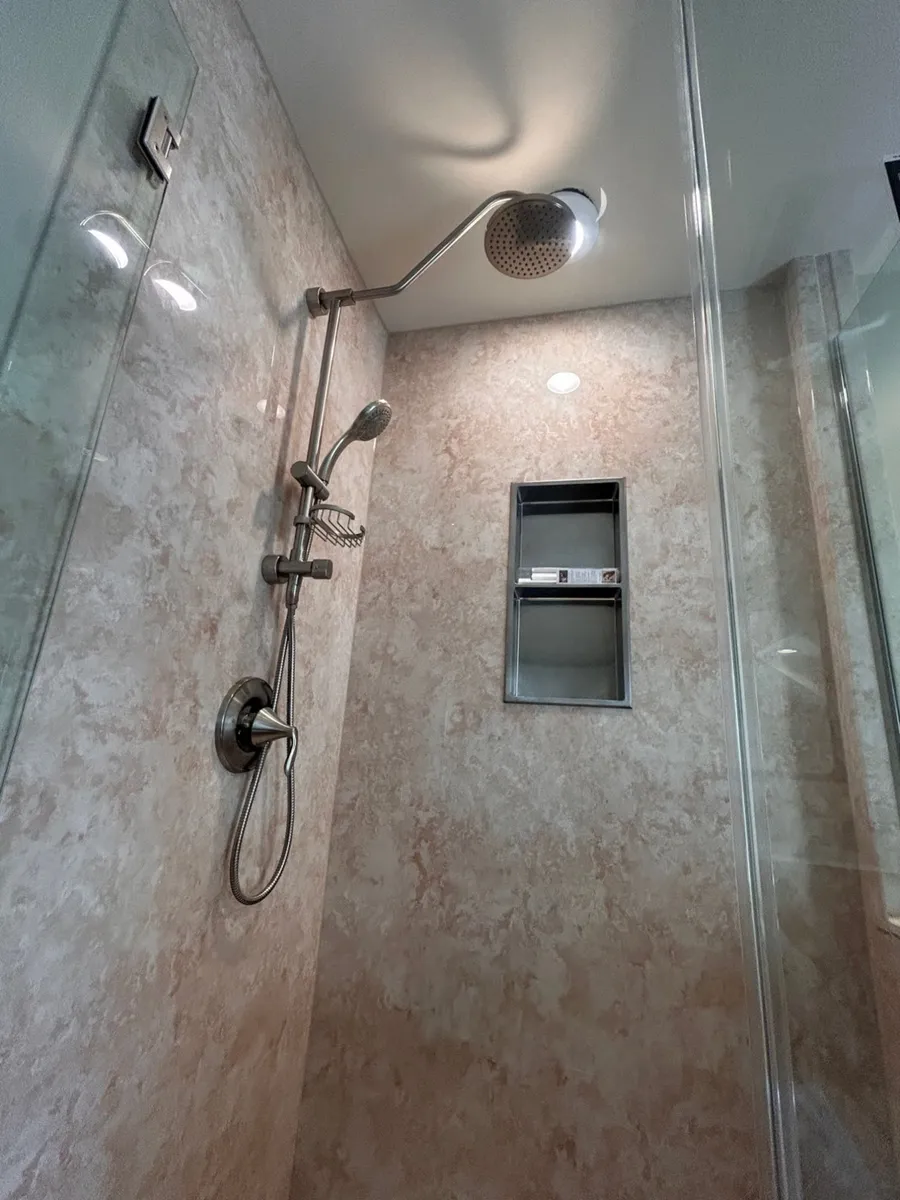 Rain shower head and handheld combo on a slide bar with recessed niche